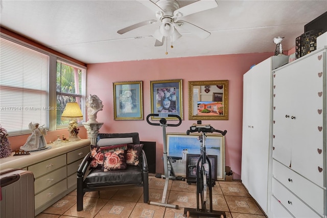 living area featuring radiator and ceiling fan