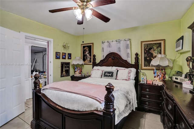 bedroom featuring a ceiling fan, a wall mounted AC, and light tile patterned floors