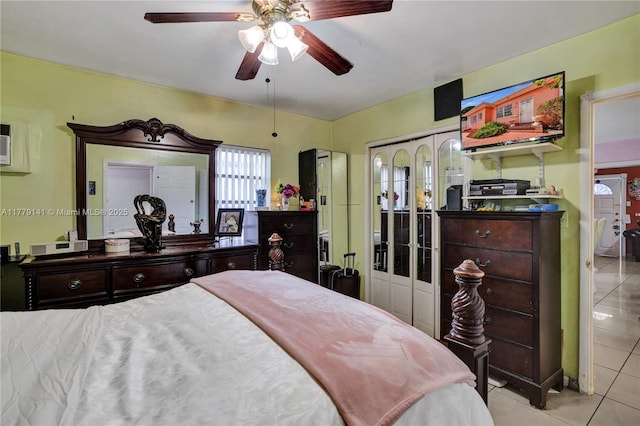 bedroom with tile patterned floors and ceiling fan