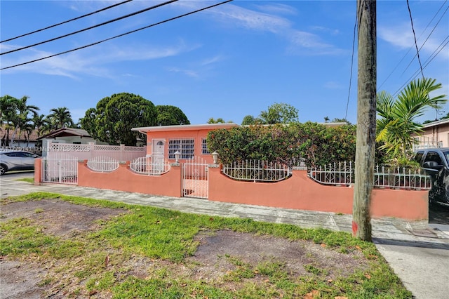 view of front of home with a gate and a fenced front yard