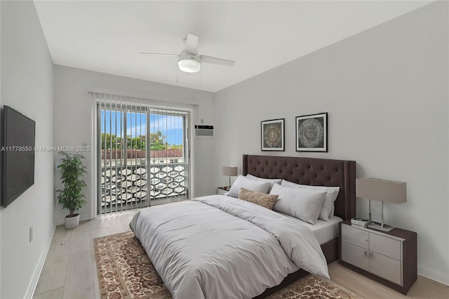 15600 NE 6th Ave Unit 30A, Miami, FL 33162 - bedroom with an AC wall unit, baseboards, and a ceiling fan
