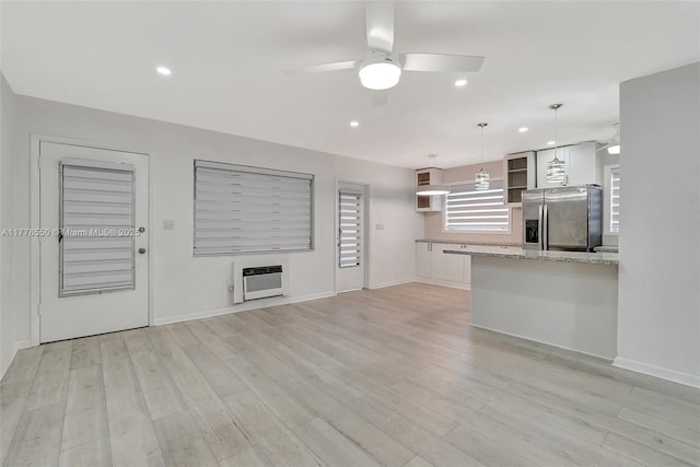15600 NE 6th Ave Unit 30A, Miami, FL 33162 - unfurnished living room with baseboards, light wood-type flooring, a ceiling fan, and heating unit