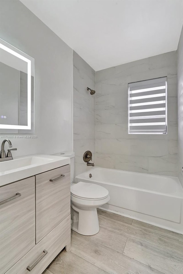 15600 NE 6th Ave Unit 30A, Miami, FL 33162 - bathroom with toilet, radiator heating unit, vanity, and bathtub / shower combination