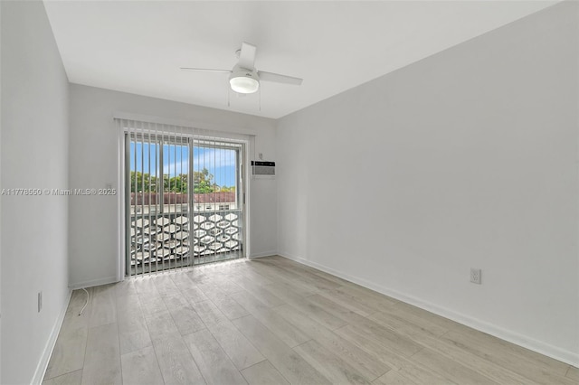 15600 NE 6th Ave Unit 30A, Miami, FL 33162 - unfurnished room featuring a wall mounted air conditioner, light wood-type flooring, baseboards, and ceiling fan