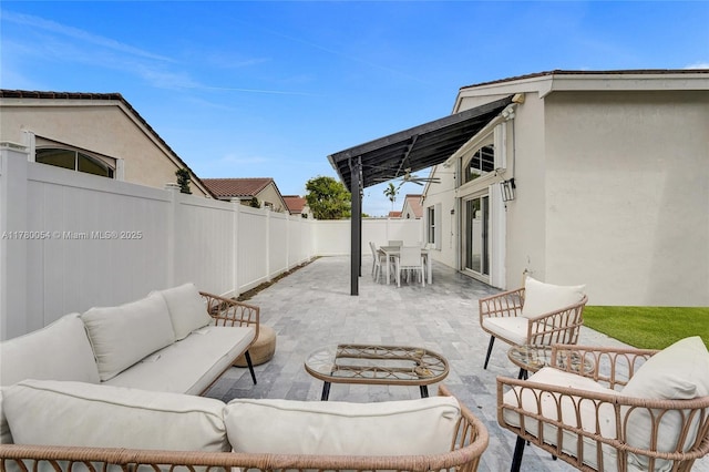 view of patio with an outdoor living space, a fenced backyard, and outdoor dining area