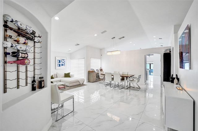interior space with visible vents, recessed lighting, arched walkways, and marble finish floor