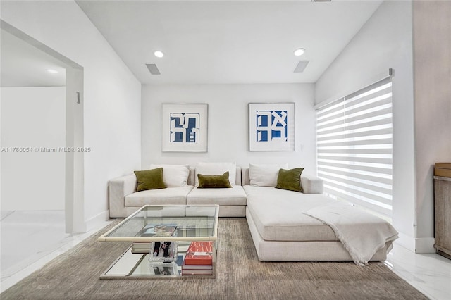 living area featuring visible vents, recessed lighting, and marble finish floor