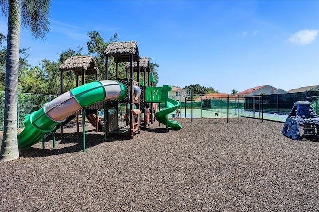 communal playground featuring fence