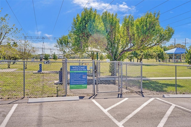 view of home's community featuring fence and a lawn