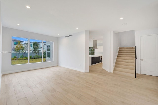3527 Forest View Cir, Dania Beach, FL 33312 - unfurnished living room with recessed lighting, baseboards, stairs, and light wood-type flooring