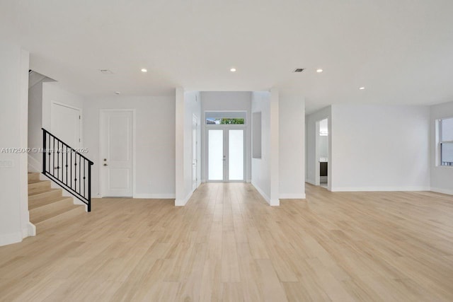 3527 Forest View Cir, Dania Beach, FL 33312 - unfurnished living room featuring light wood-type flooring, baseboards, recessed lighting, visible vents, and stairs