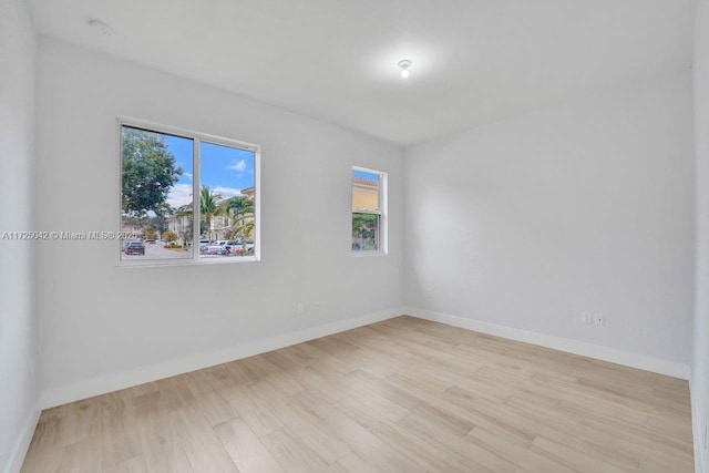 3527 Forest View Cir, Dania Beach, FL 33312 - spare room with baseboards and wood finished floors