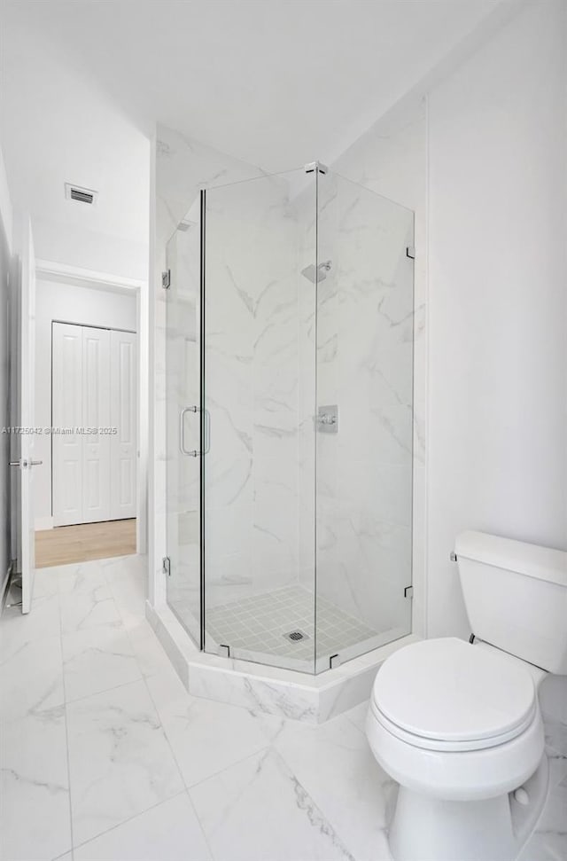 3527 Forest View Cir, Dania Beach, FL 33312 - full bath with visible vents, marble finish floor, a marble finish shower, and toilet