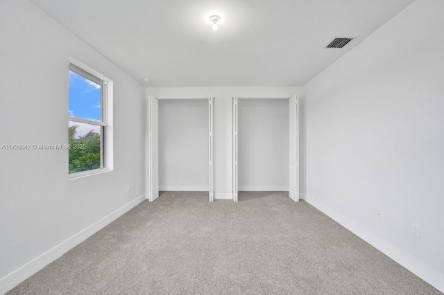 3527 Forest View Cir, Dania Beach, FL 33312 - unfurnished bedroom with two closets, baseboards, carpet flooring, and visible vents