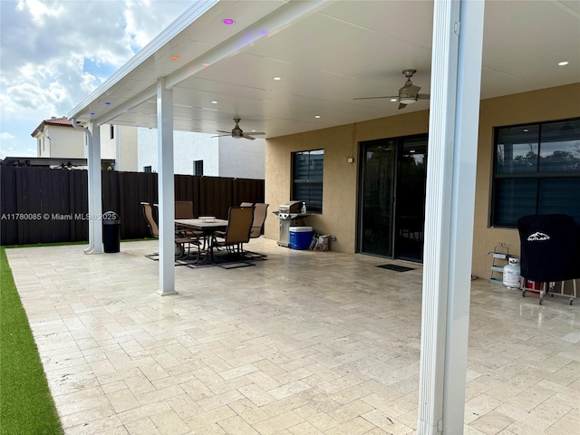 10060 NW 86th Ter, Doral, FL 33178 - view of patio with outdoor dining area, ceiling fan, and fence