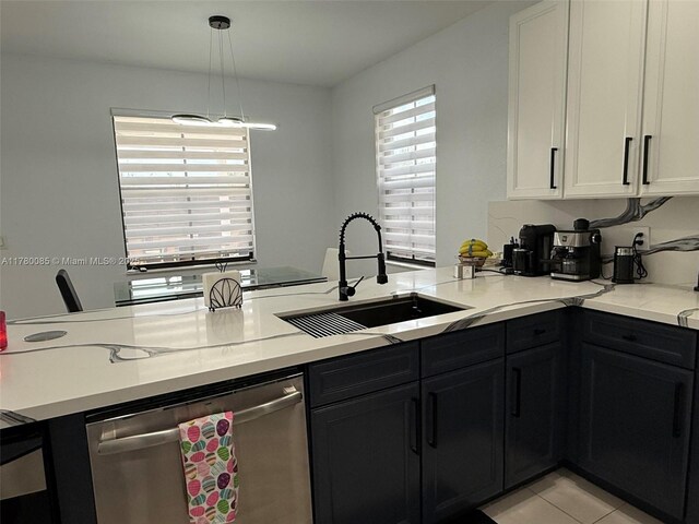 10060 NW 86th Ter, Doral, FL 33178 - kitchen featuring dishwasher, a sink, a peninsula, white cabinets, and pendant lighting
