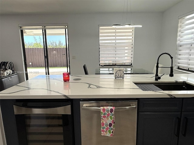 10060 NW 86th Ter, Doral, FL 33178 - kitchen featuring stainless steel dishwasher, wine cooler, a sink, and light countertops