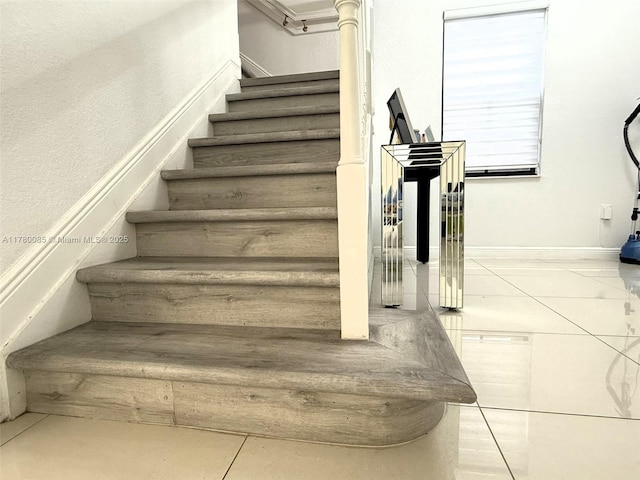 10060 NW 86th Ter, Doral, FL 33178 - stairs featuring tile patterned floors and baseboards