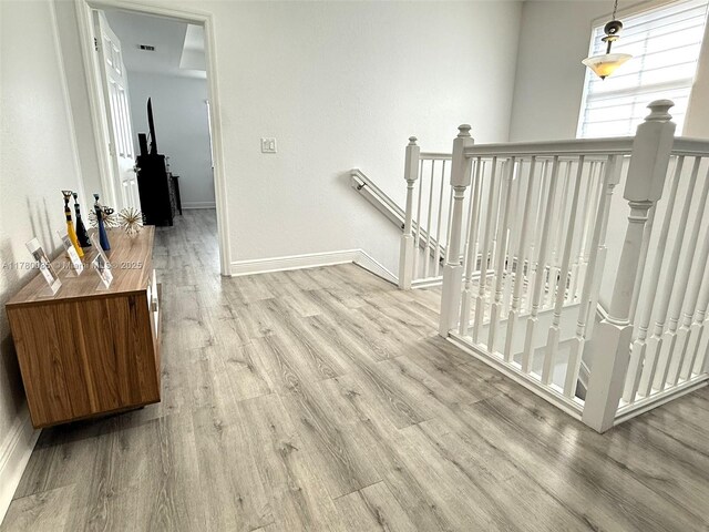 10060 NW 86th Ter, Doral, FL 33178 - hall featuring an upstairs landing, wood finished floors, and baseboards