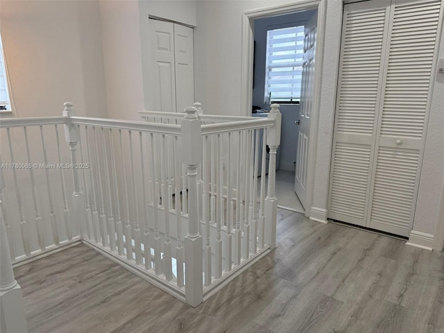 10060 NW 86th Ter, Doral, FL 33178 - corridor featuring an upstairs landing, wood finished floors, and baseboards