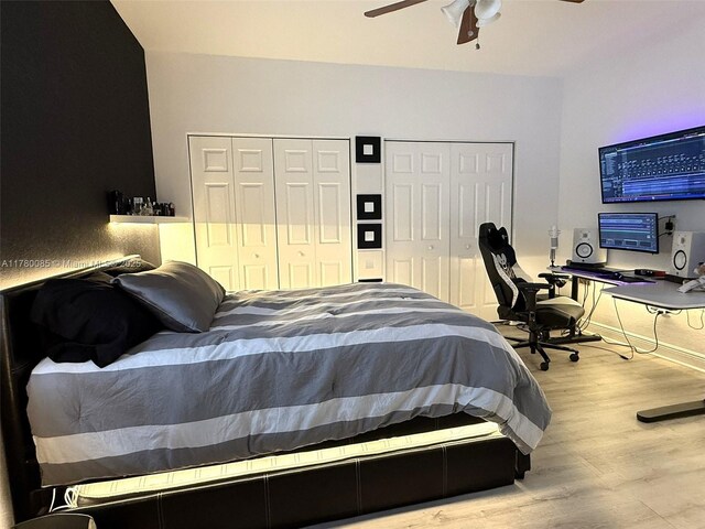 10060 NW 86th Ter, Doral, FL 33178 - bedroom featuring multiple closets, wood finished floors, and ceiling fan