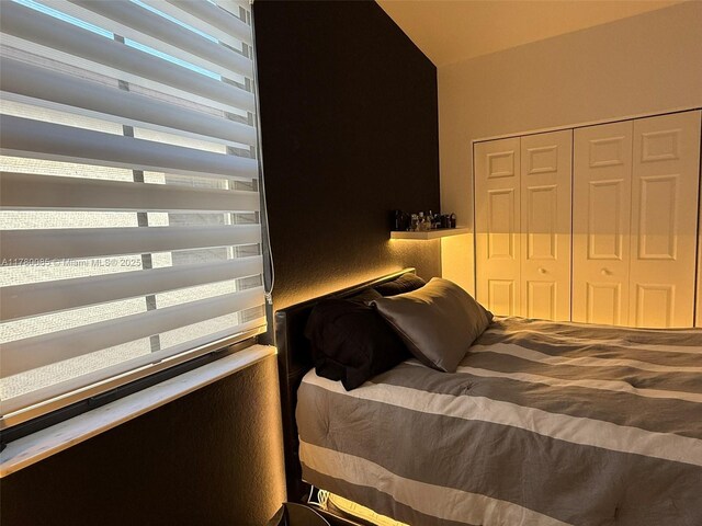 10060 NW 86th Ter, Doral, FL 33178 - bedroom with a closet and lofted ceiling