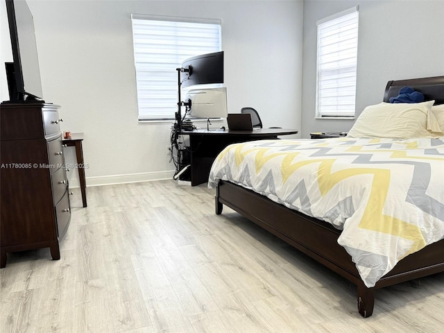 10060 NW 86th Ter, Doral, FL 33178 - bedroom with light wood finished floors and baseboards