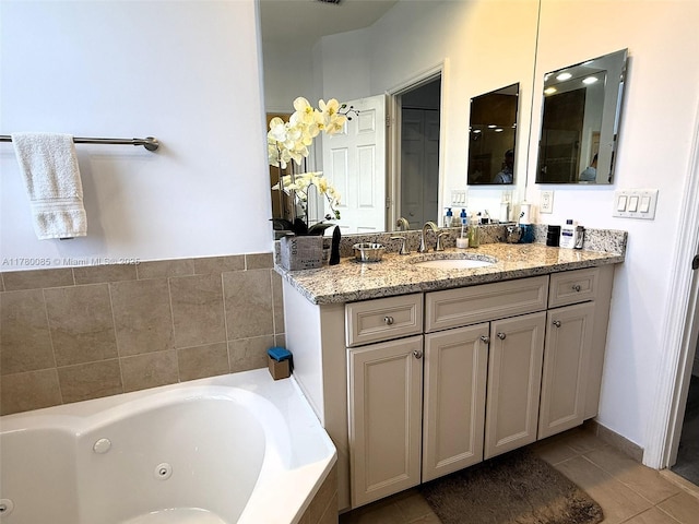 10060 NW 86th Ter, Doral, FL 33178 - bathroom with a tub with jets, vanity, and tile patterned floors