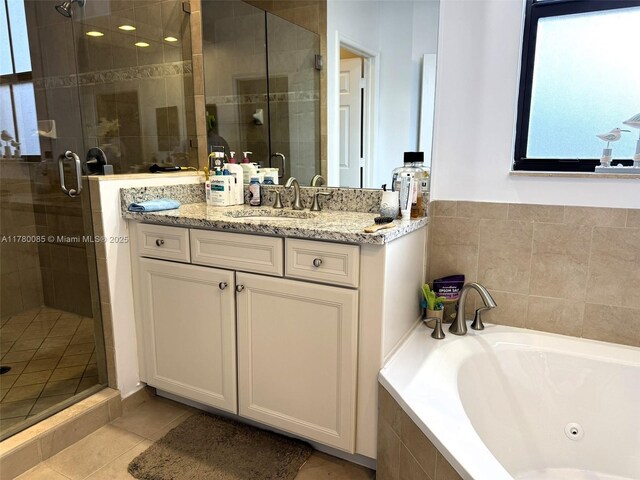 10060 NW 86th Ter, Doral, FL 33178 - bathroom with a whirlpool tub, a stall shower, vanity, and tile patterned flooring