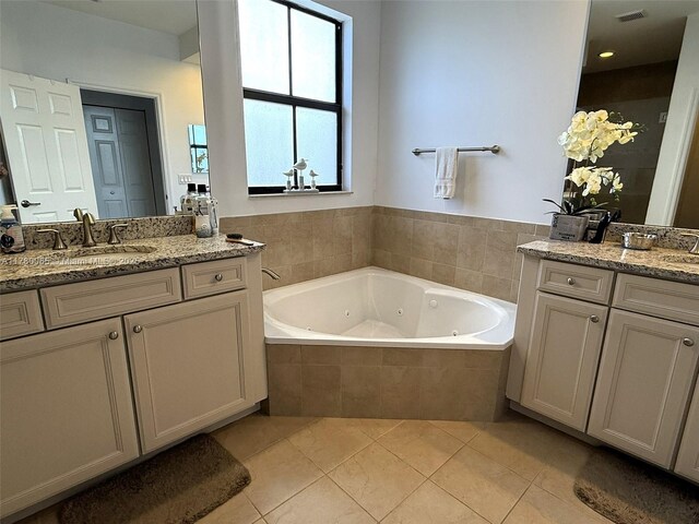 10060 NW 86th Ter, Doral, FL 33178 - full bath featuring a tub with jets, tile patterned floors, and two vanities