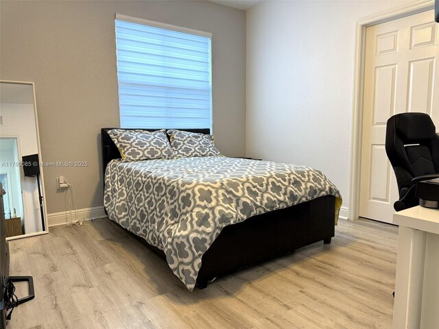10060 NW 86th Ter, Doral, FL 33178 - bedroom featuring light wood-style floors and baseboards