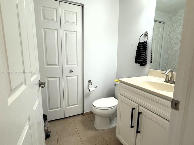 10060 NW 86th Ter, Doral, FL 33178 - bathroom with tile patterned flooring, vanity, and toilet