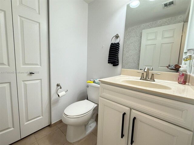 10060 NW 86th Ter, Doral, FL 33178 - bathroom with tile patterned floors, vanity, and toilet