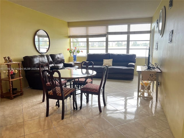 18555 NE 14th Ave Unit 516, Miami, FL 33179 - dining area with plenty of natural light and light tile patterned flooring