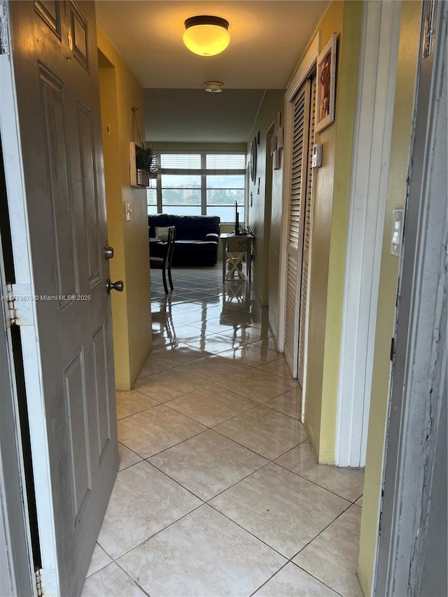 18555 NE 14th Ave Unit 516, Miami, FL 33179 - hall featuring light tile patterned floors