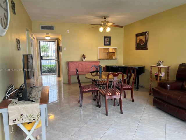 18555 NE 14th Ave Unit 516, Miami, FL 33179 - dining space with visible vents, a ceiling fan, and light tile patterned floors