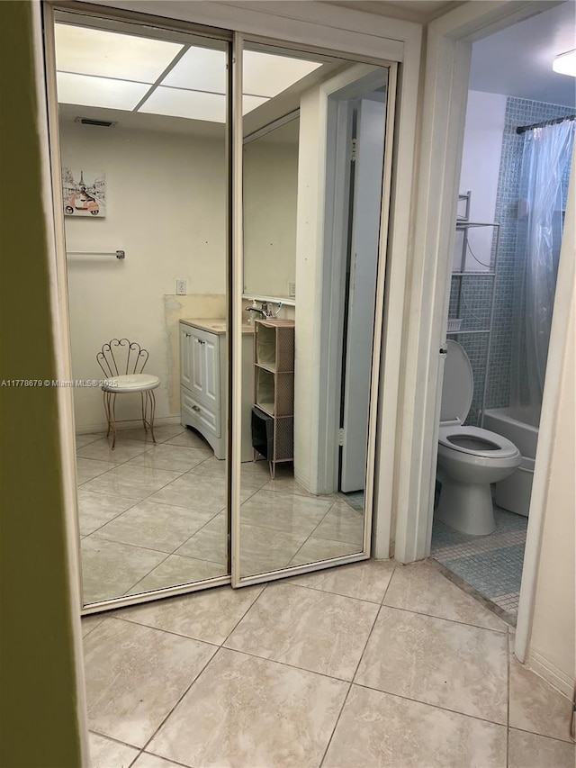 18555 NE 14th Ave Unit 516, Miami, FL 33179 - full bathroom featuring tile patterned flooring, vanity, toilet, and shower / bath combination with curtain