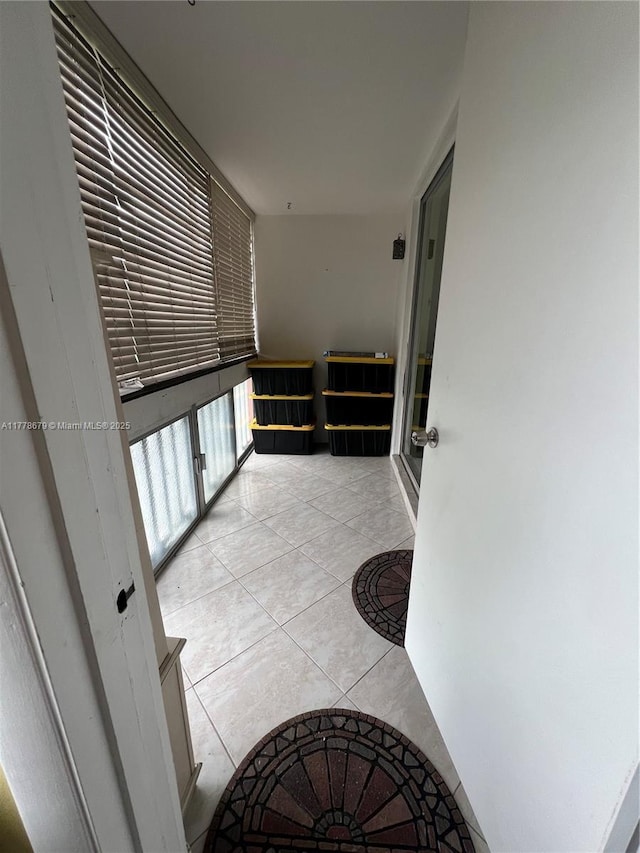 18555 NE 14th Ave Unit 516, Miami, FL 33179 - hallway with light tile patterned flooring