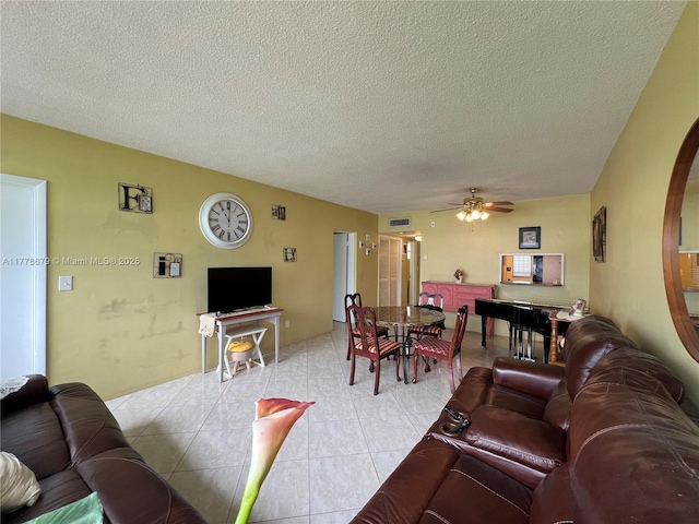 18555 NE 14th Ave Unit 516, Miami, FL 33179 - living area with light tile patterned floors, ceiling fan, visible vents, and a textured ceiling