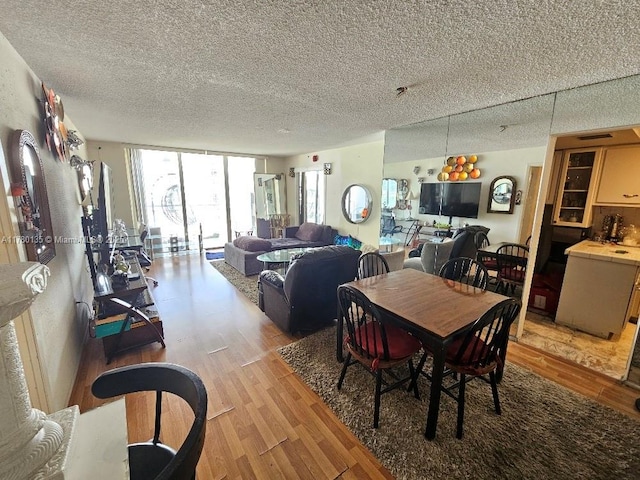 18061 Biscayne Blvd Unit 802, Aventura, FL 33160 - dining area featuring light wood-style floors and a textured ceiling