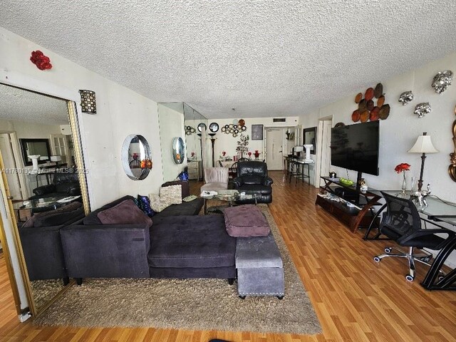 18061 Biscayne Blvd Unit 802, Aventura, FL 33160 - living room with wood finished floors and a textured ceiling
