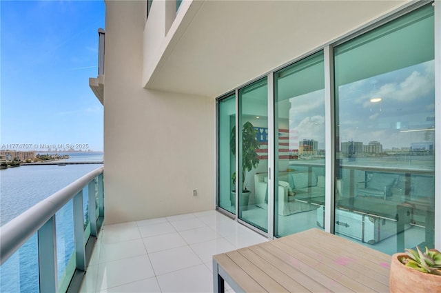 balcony with a water view and a city view