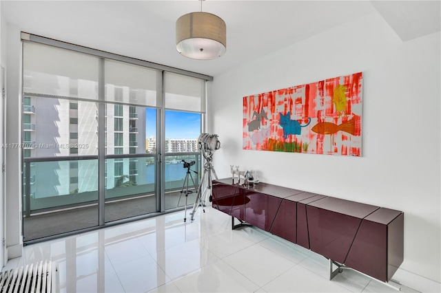 interior space with tile patterned floors and expansive windows