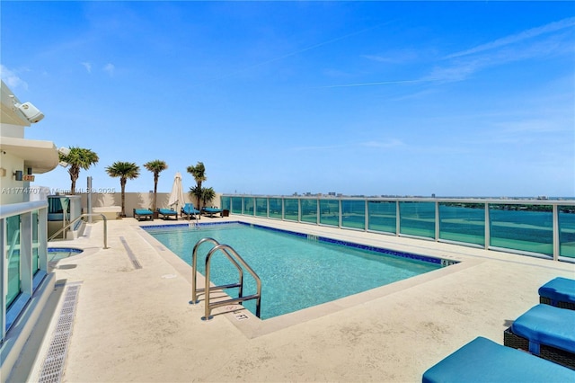 pool with a patio area