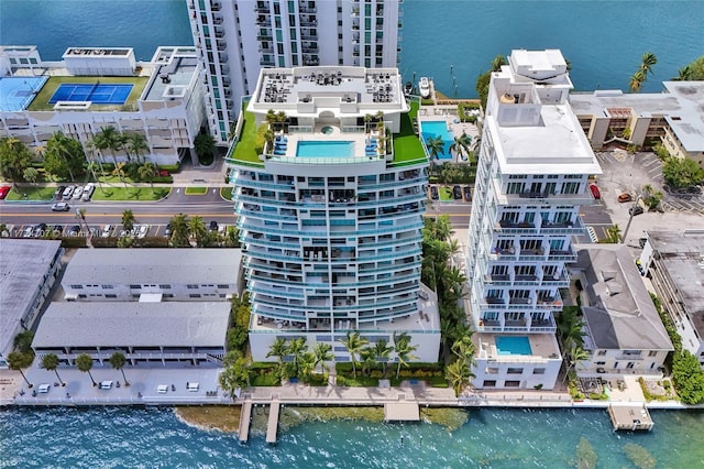 birds eye view of property with a water view