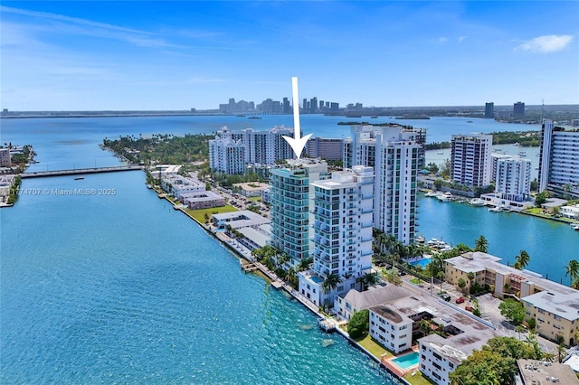 aerial view featuring a view of city and a water view