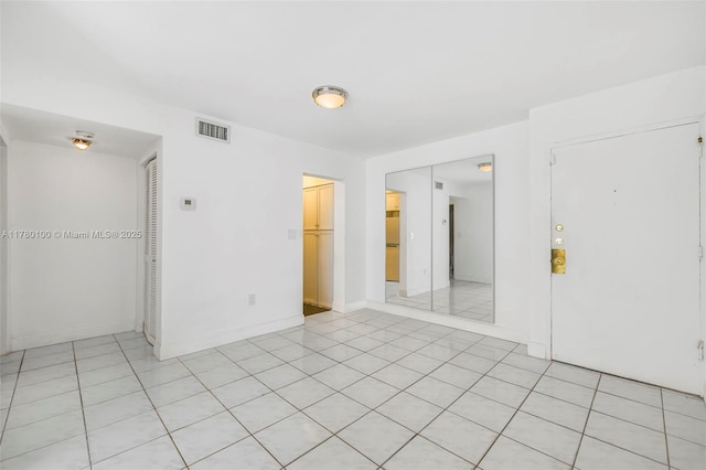spare room with visible vents and baseboards