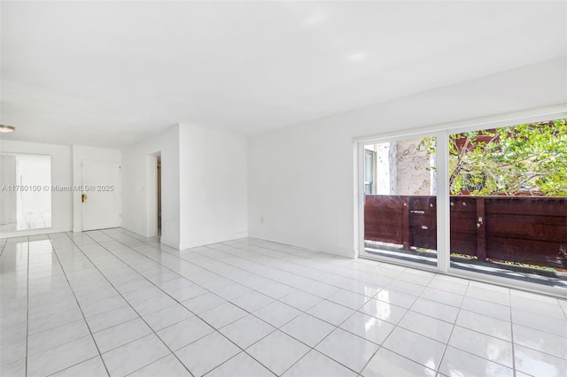 empty room featuring light tile patterned floors