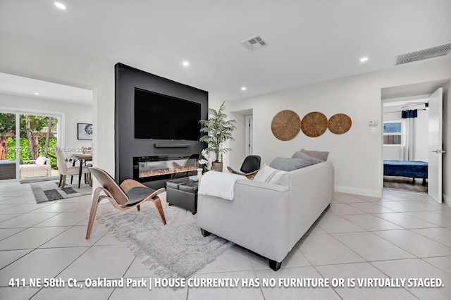 411 NE 58th Ct, Oakland Park, FL 33334 - living area featuring light tile patterned flooring, visible vents, and recessed lighting