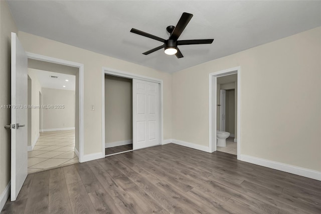 411 NE 58th Ct, Oakland Park, FL 33334 - unfurnished bedroom featuring baseboards, a closet, and wood finished floors